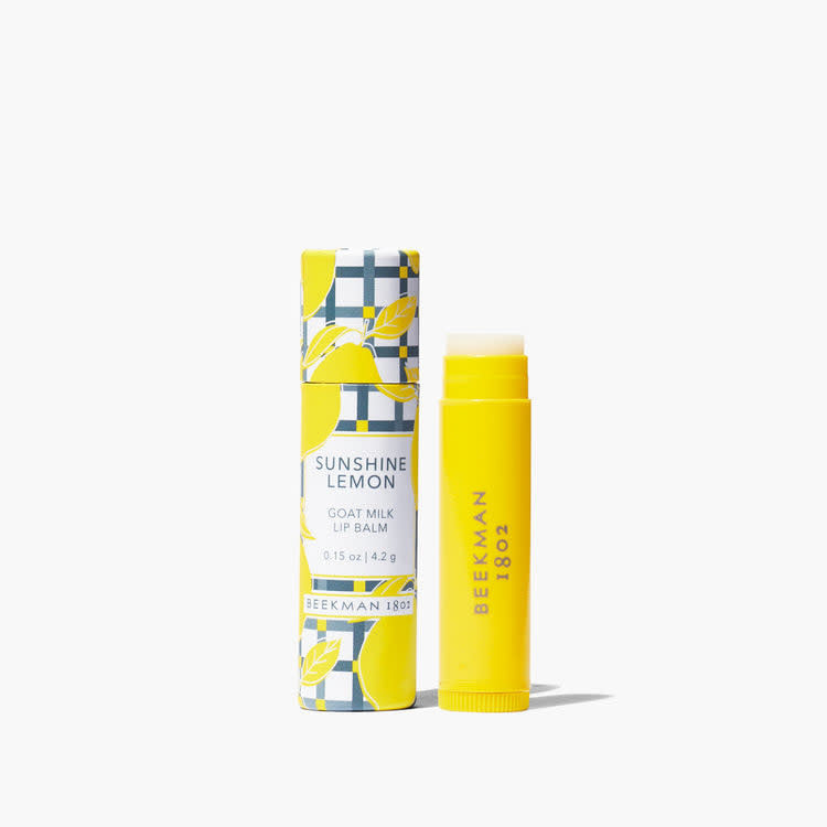 Beekman Lip Balm in Sunshine Lemon with a clear tube and gingham pattern.