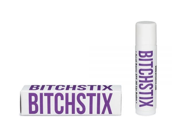 A tube of organic lip balm with a white cap.