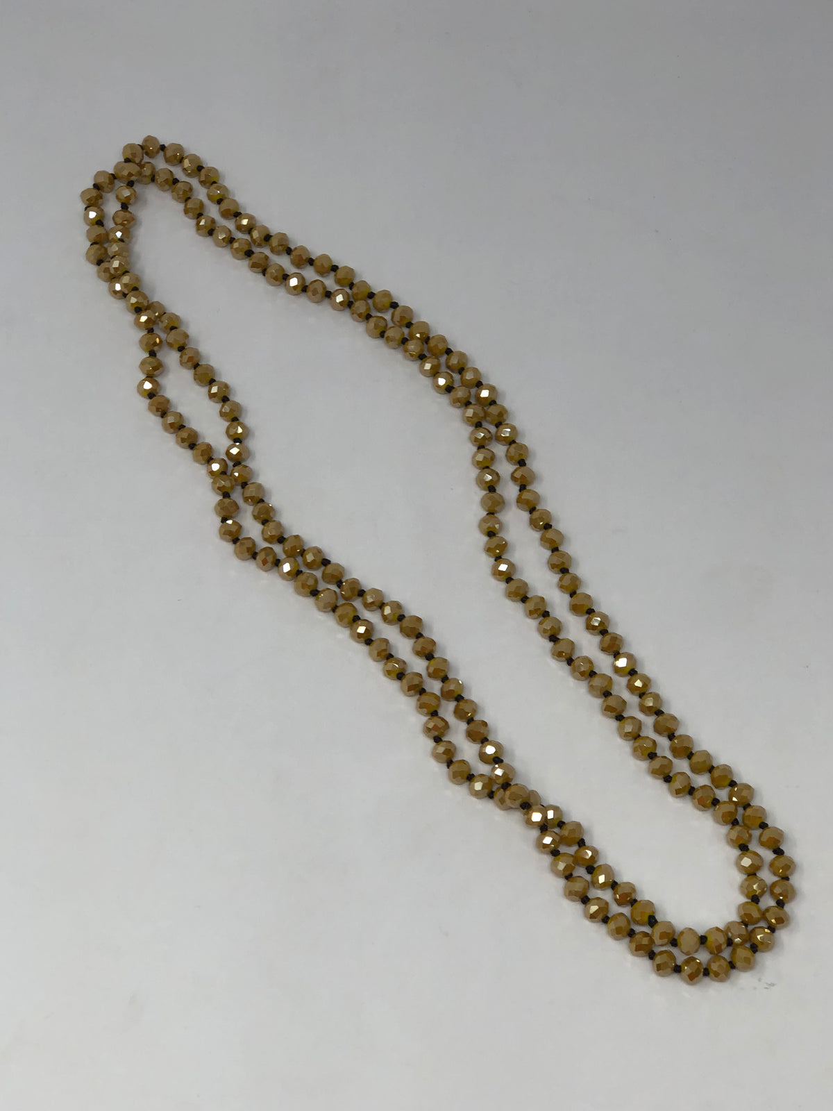 60-inch dark brown crystal beaded necklace with knotting between each bead
