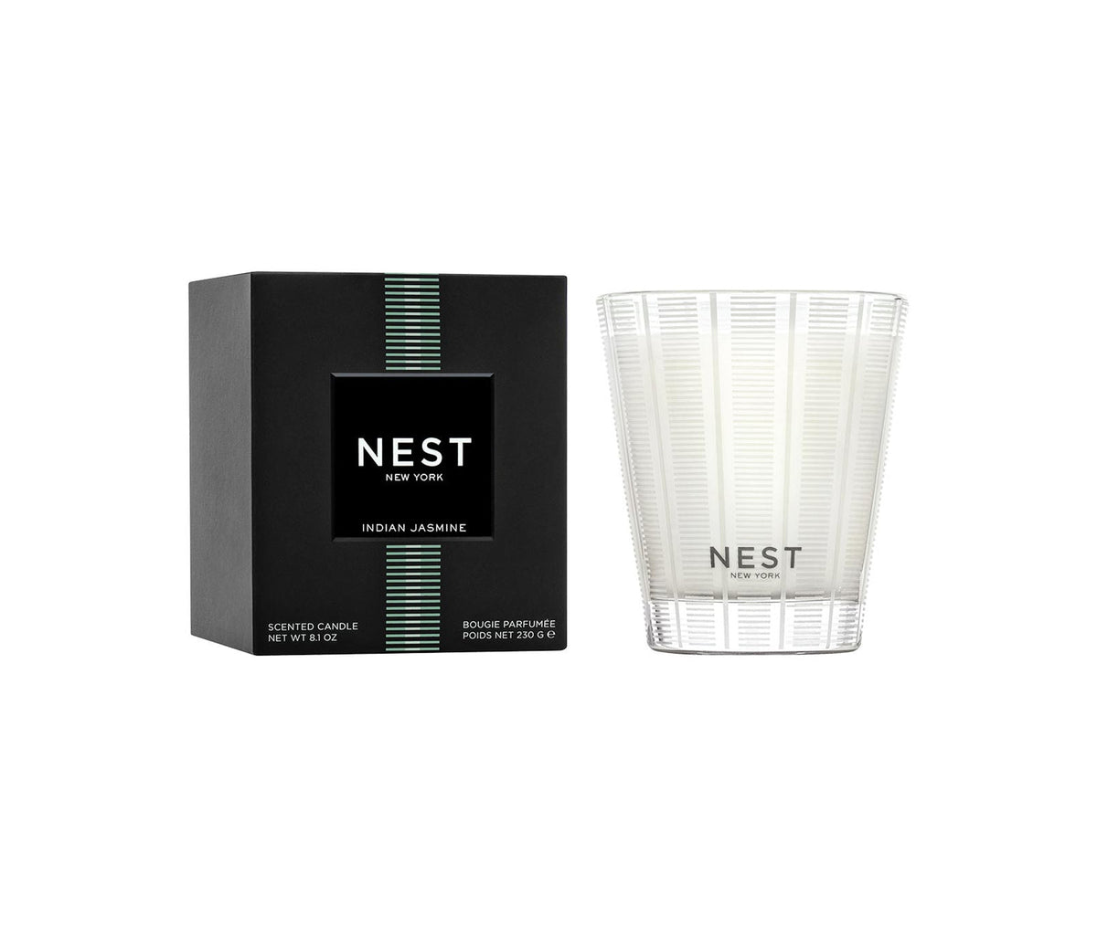 Nest Indian Jasmine Classic Candle in a clear textured glass jar next to its black and green box.
