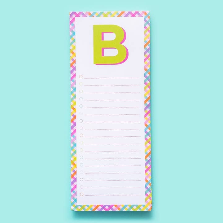 4-inch by 10-inch lined list pad letters with a magnet on the back.
