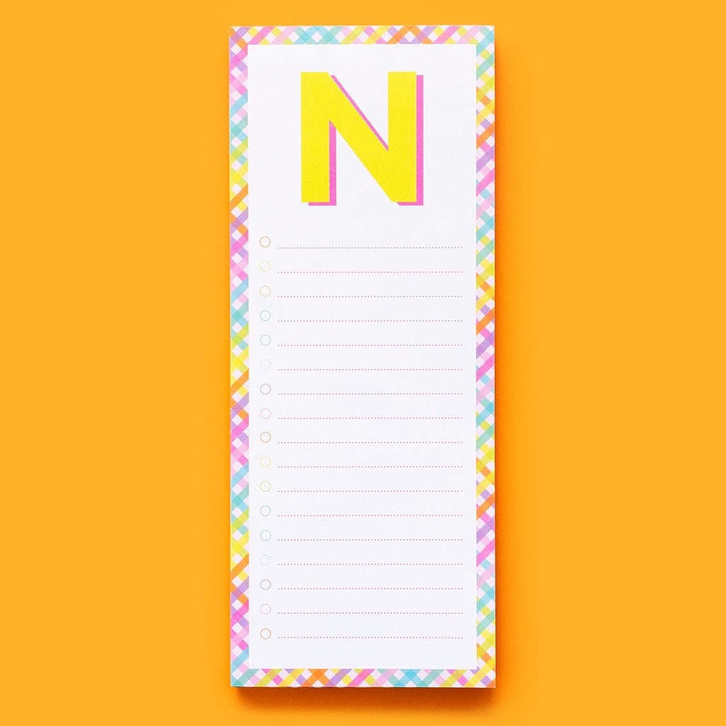 List pad letters featuring lined paper sheets with a magnet on the back.