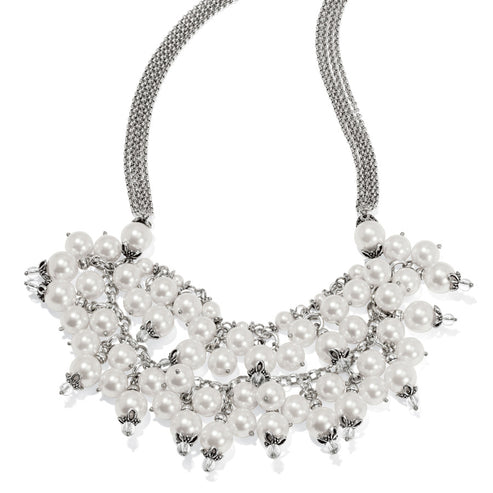 Silver-plated necklace featuring multiple tiers of white glass pearls on a textured chain.