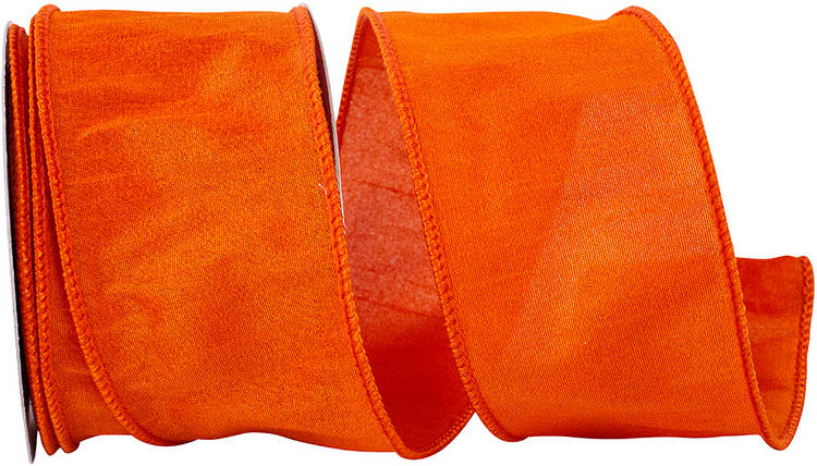 2-1/2 inch tangerine orange Dupioni wired edge ribbon coiled on a spool.