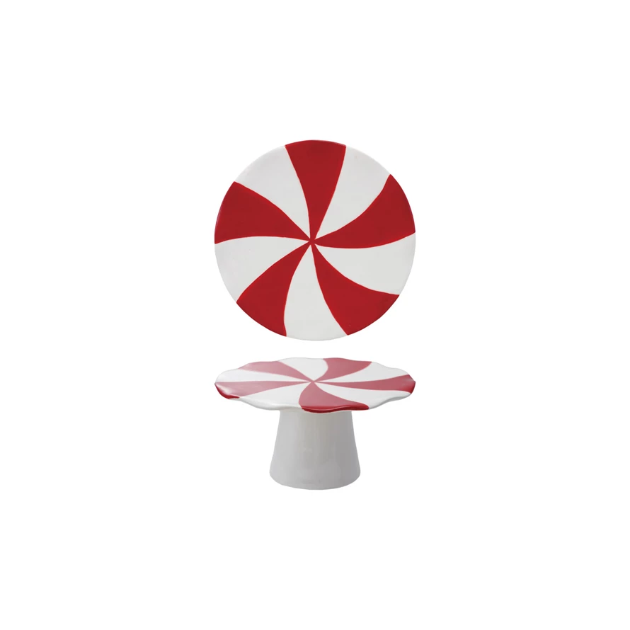 Ceramic peppermint candy shaped pedestal with red and white swirls and a scalloped edge.