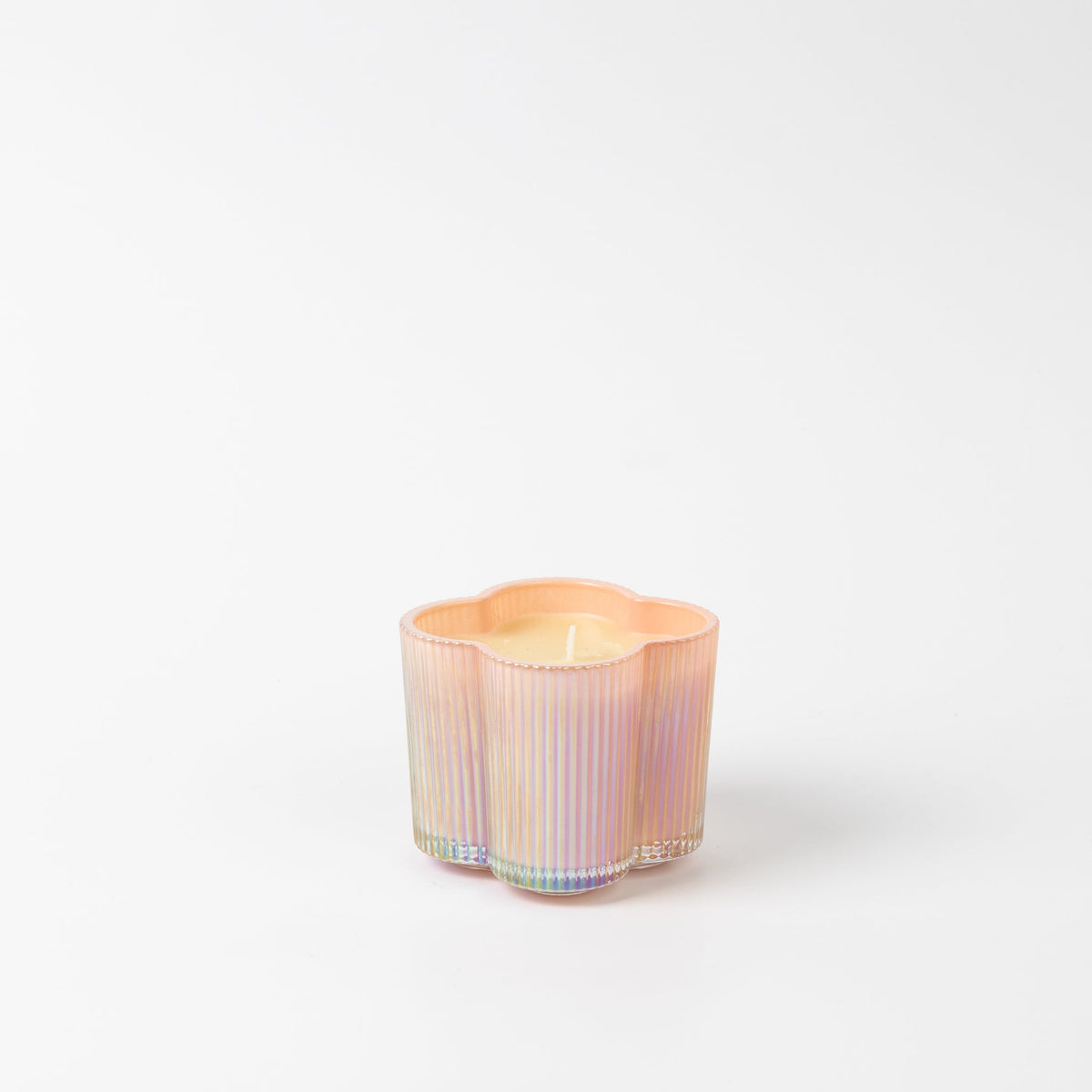 Sweet Grace Collection candle in a clear glass jar with white wax.