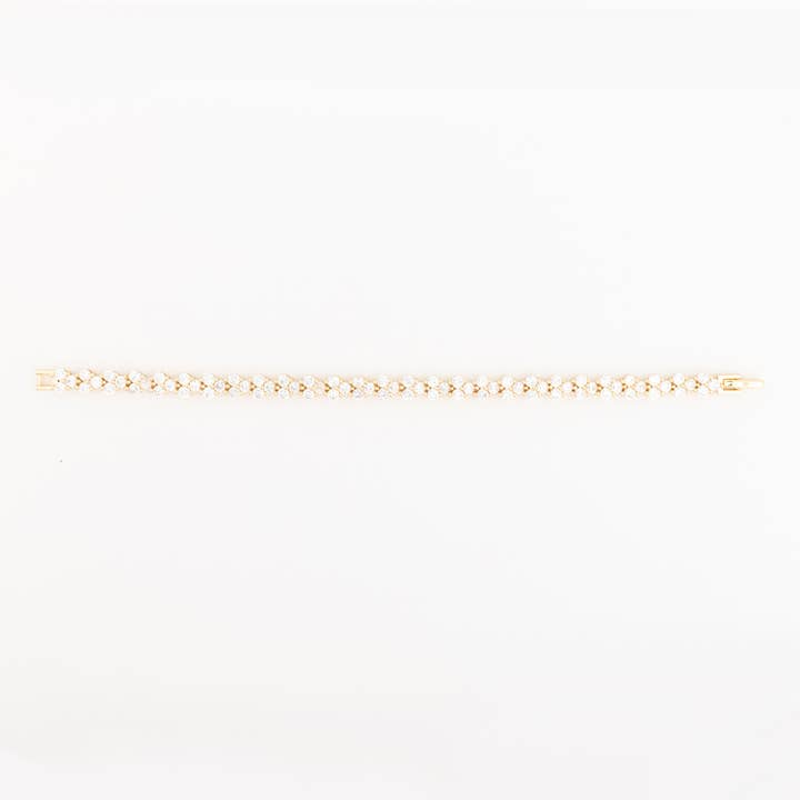 Gold-tone Bracelet Bristol featuring a double row of round-cut clear crystals in a link design.