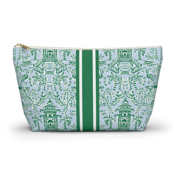 Mahjong tile pouch with green chinoiserie pattern, central stripes, and gold zipper on light blue.