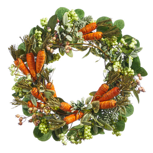 A round wreath featuring orange carrots mixed with greenery, berries, raffia, and twigs.