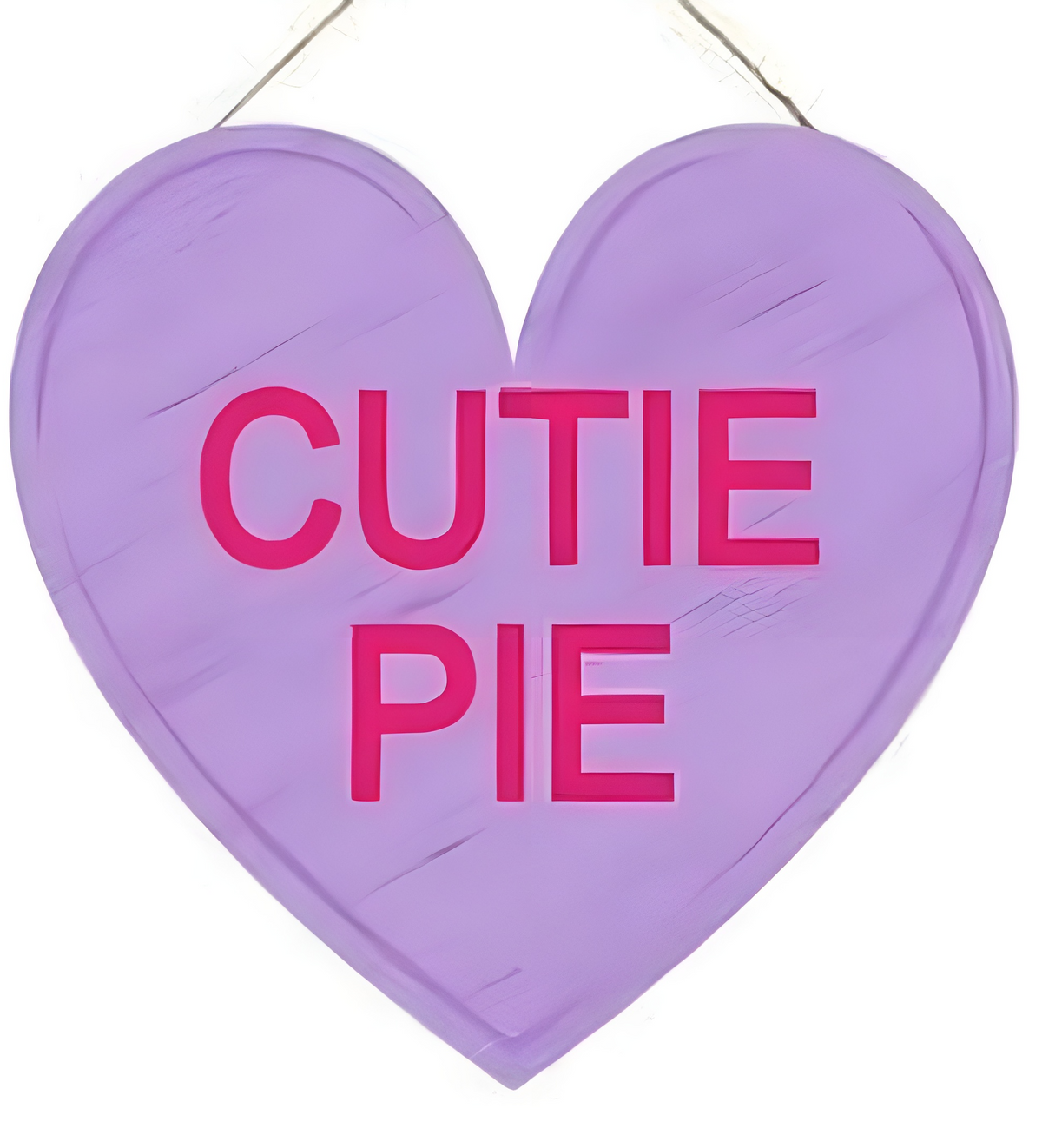 Purple heart-shaped candy heart sign with pink text reading CUTIE PIE.