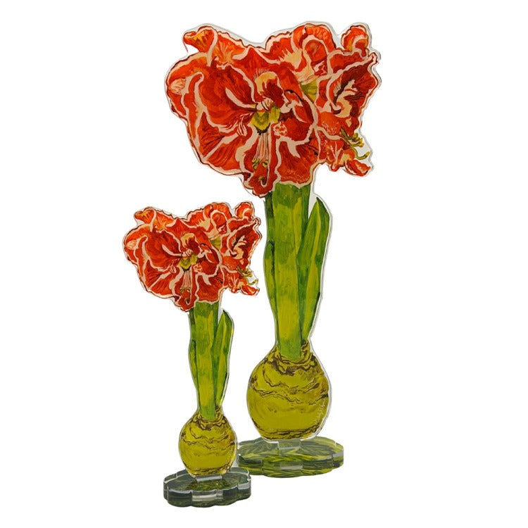 Single artificial amaryllis flower with ruffled petals in a vase