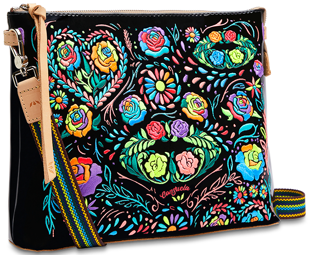 Rita Downtown Crossbody bag in black patent leather with colorful floral embroidery and woven strap.