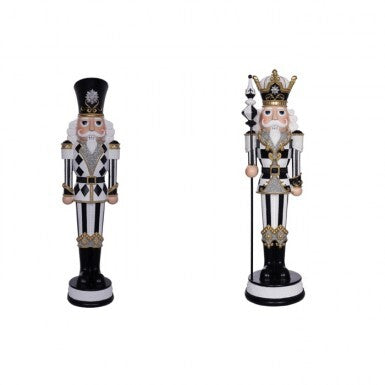 Two 19-inch resin royal nutcrackers in black, white, and gold with harlequin and striped patterns.