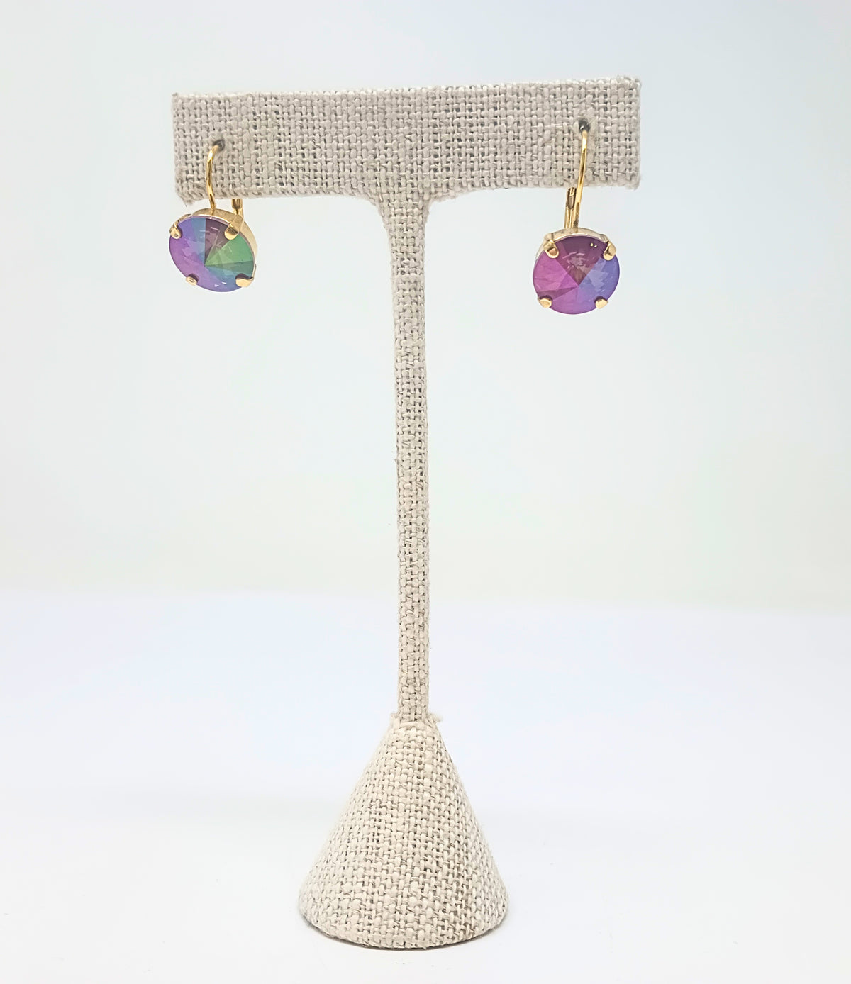 Caitlin Round Earrings with iridescent purple and green crystals on antique gold hoops.