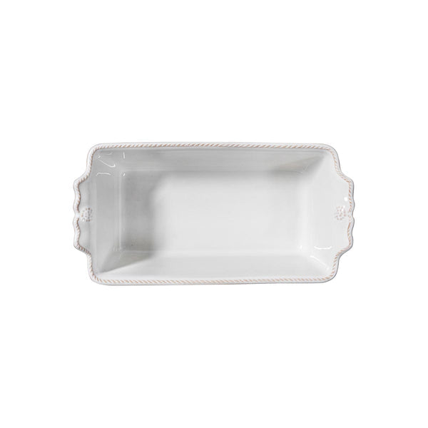Whitewash ceramic loaf pan with scalloped handles and a decorative berry and thread border.