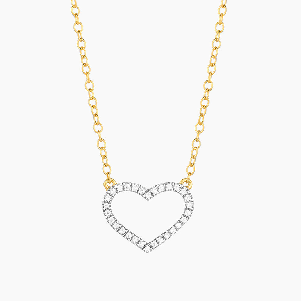 Sterling silver pendant necklace with gold-plated finish featuring a heart-shaped silhouette set with small diamonds.