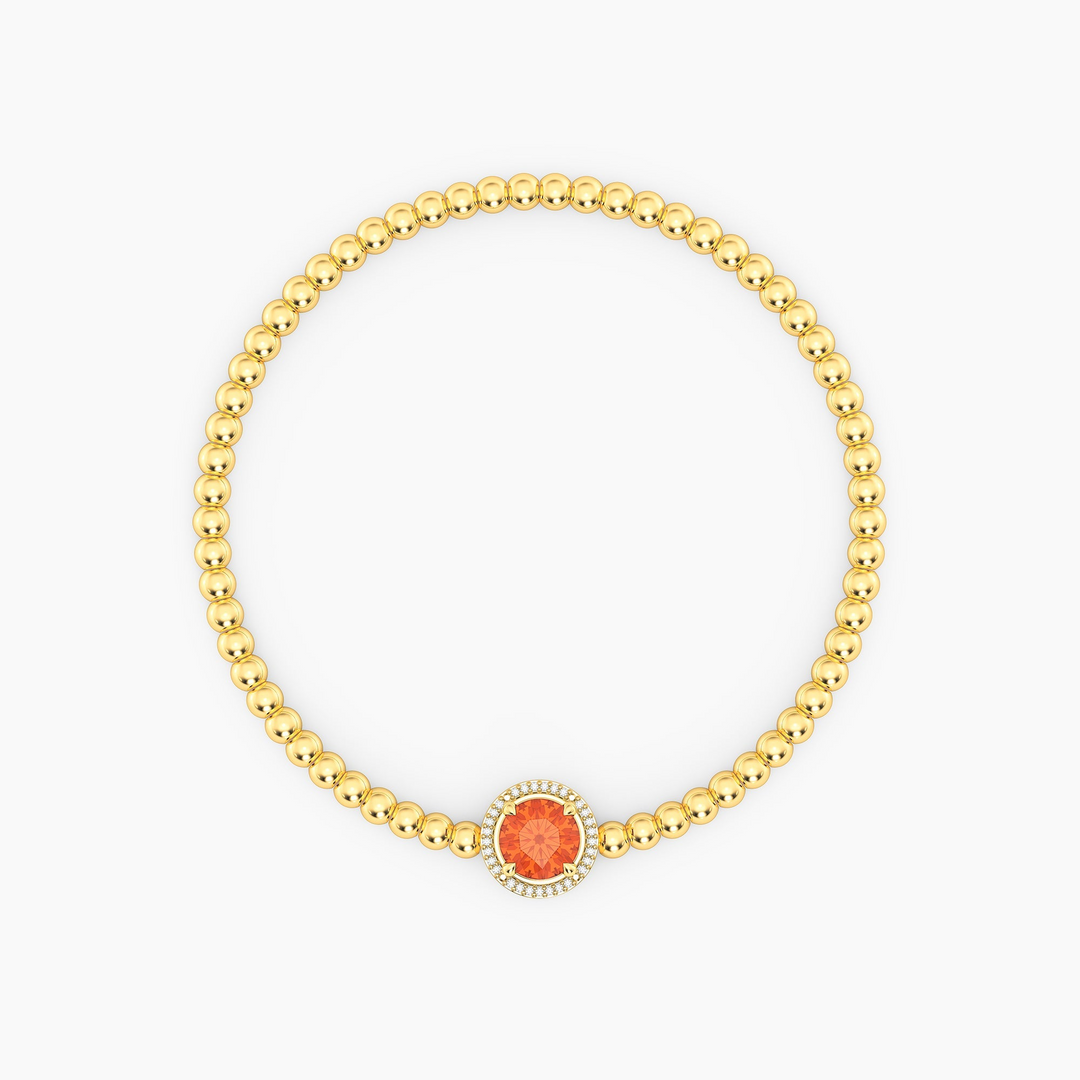 Gold-plated beaded bracelet with an orange round-cut center stone and a diamond halo.