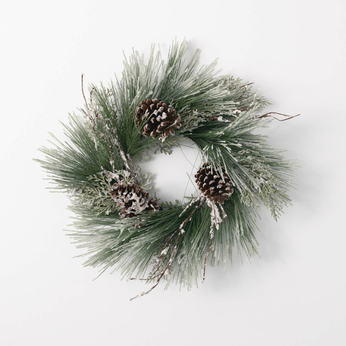 6.5-inch iced pine ring wreath with green needles and three frosted pinecones on a white background.