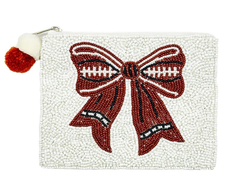 White beaded pouch featuring a red and black football-themed bow design with a pom-pom zipper pull.