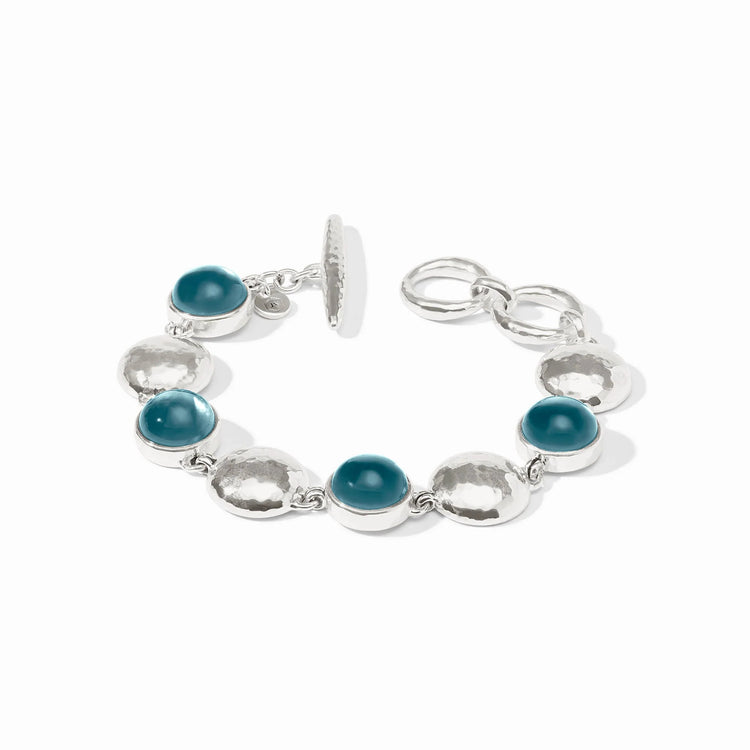 Adjustable Solara Stone bracelet with shimmering stones on a dark band.