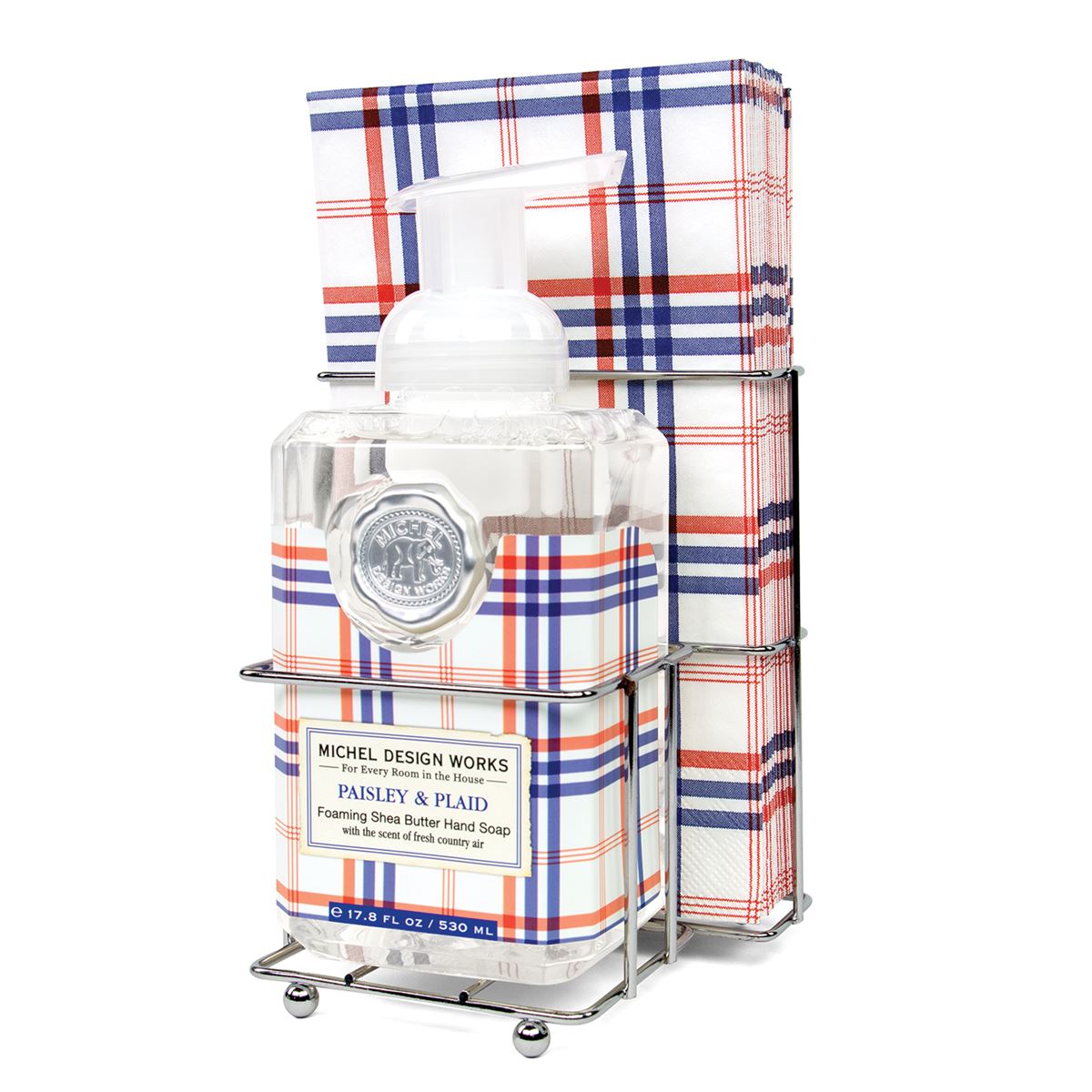 Foaming hand soap dispenser with matching napkin holder set in neutral tones.