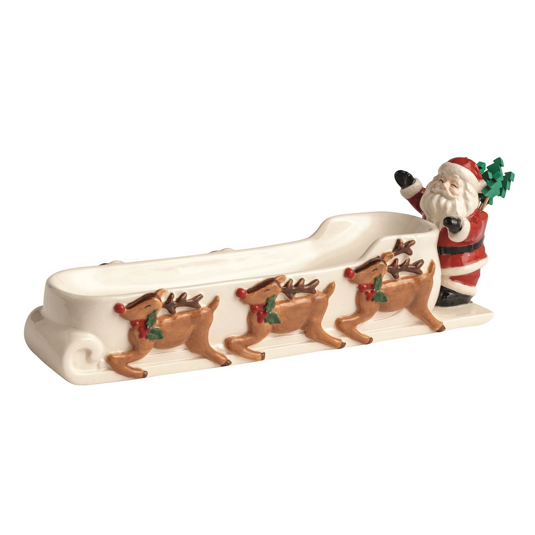 Ceramic Santa's sleigh cracker dish featuring three reindeer and a Santa figure with toothpicks.