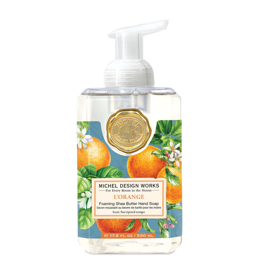 Foaming hand soap dispenser bottle in light orange with a white pump top.