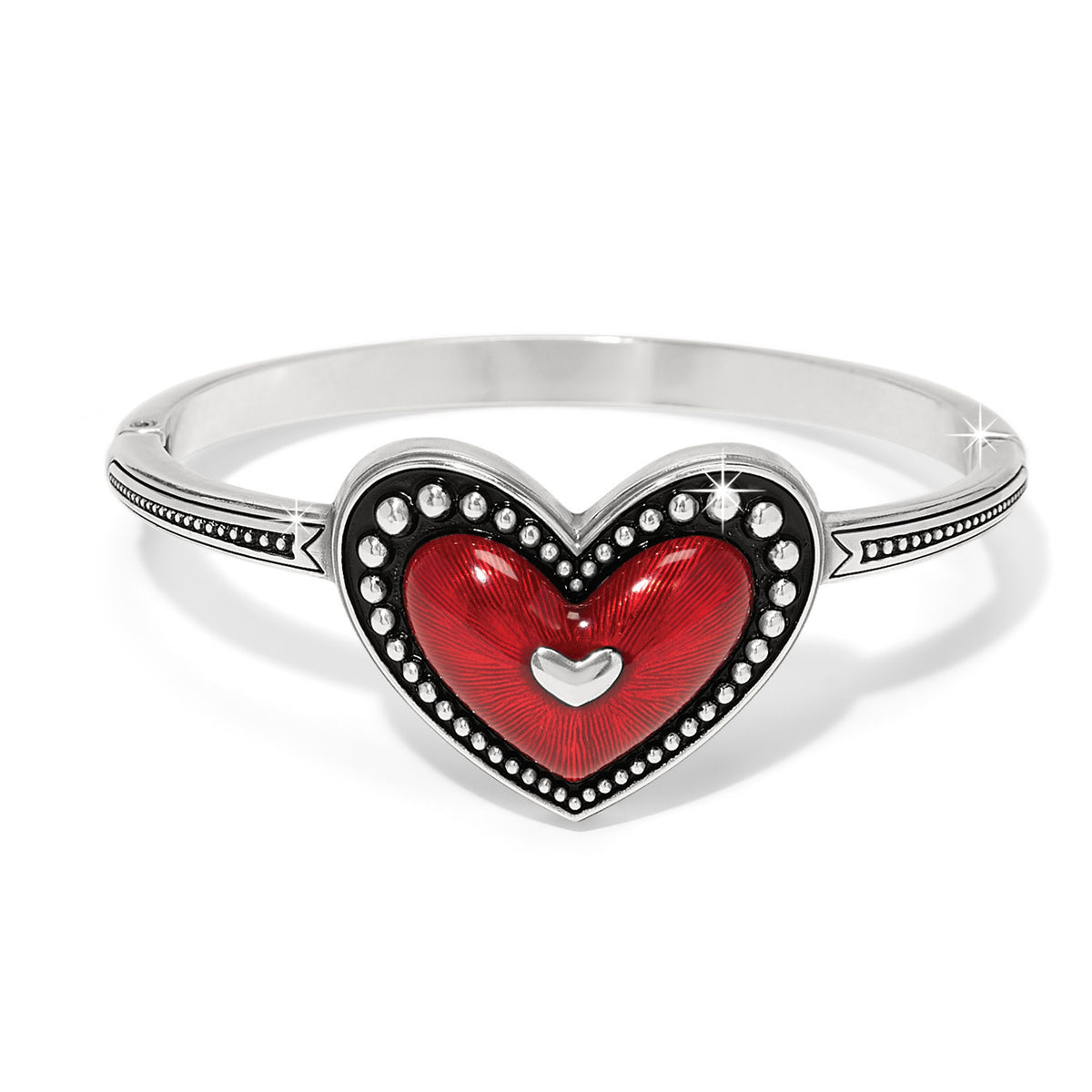 Silver hinged bangle with ruby red enamel heart framed in beading.