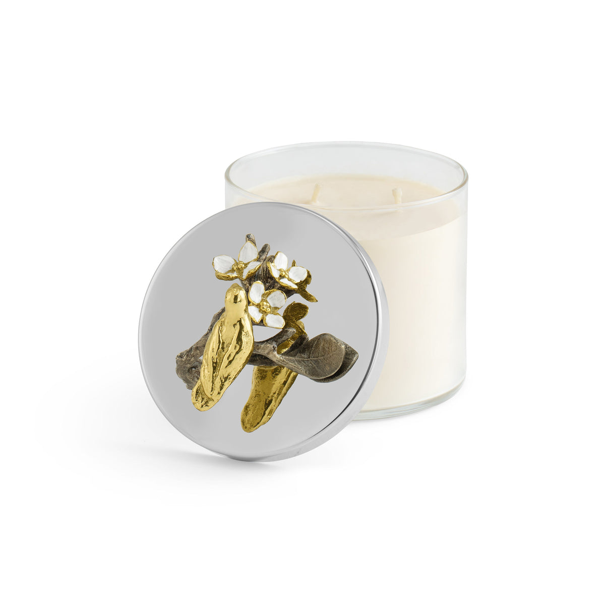 Triple wick soy candle in white enamel glass with natural brass accents; scent features magnolia and jasmine.