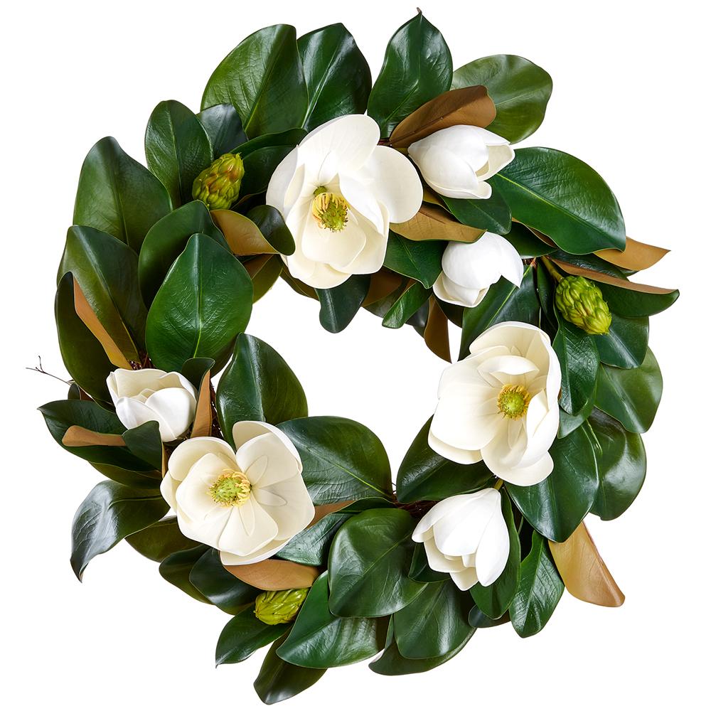 A white magnolia wreath with green accents made from plastic foam wire bamboo materials.