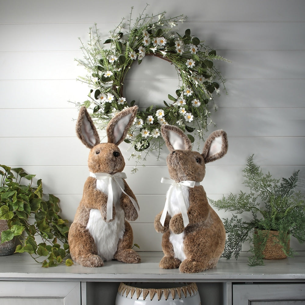 Standing faux fur bunny with bendable ears, ribbon bow, and realistic facial features in light beige.