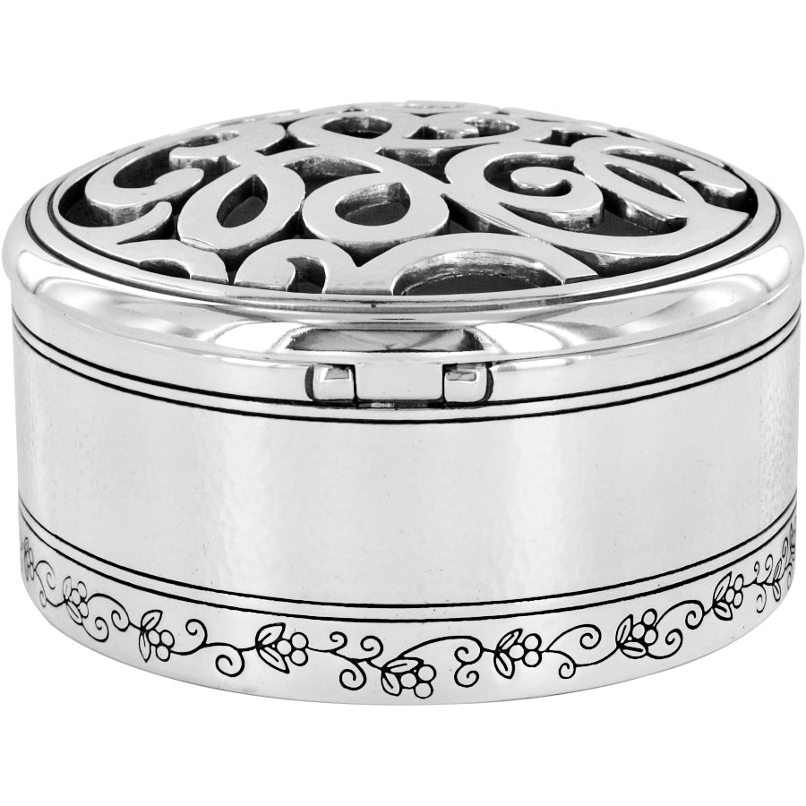 Skribbel Round Trinket Box in silver with a filigree lid and floral engraved base.