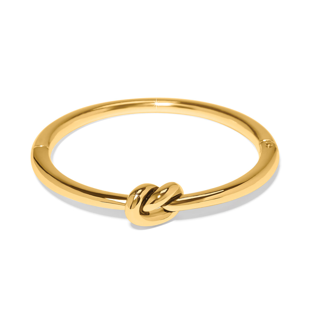 Interlok gold plated hinged bangle featuring a single knot design in the center.