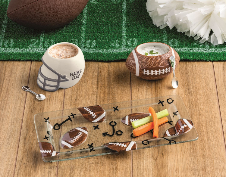 Rectangular glass tray with football and play diagram prints, holding carrot and celery sticks.