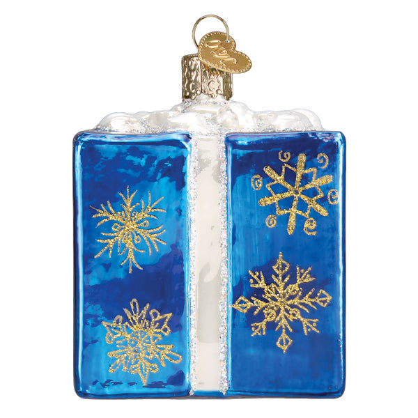Blue Hanukkah gift box glass ornament with gold glitter snowflakes and white ribbon detail.