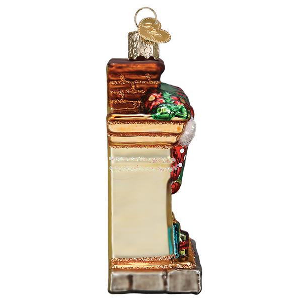 Side view of a glass Holiday Hearth Ornament featuring a chimney, mantle, and festive decorations.