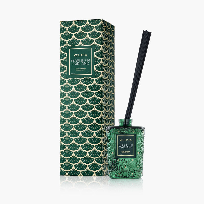 Black reed diffuser bottle with Noble Fir garland fragrance in a clear glass container.
