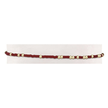 Hand-beaded Gameday Hope Unwritten bracelet with gold-filled accents on stretch elastic.