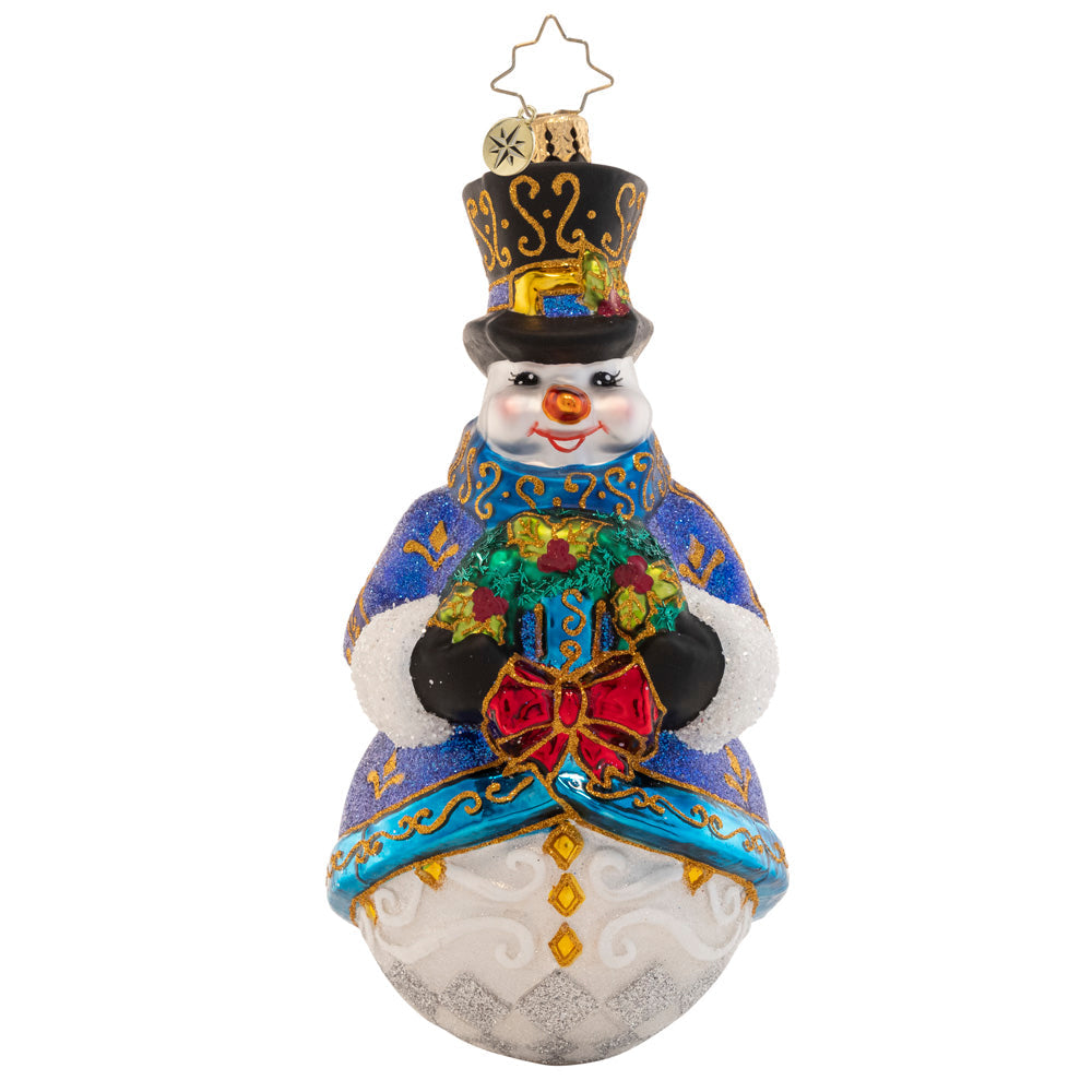Winter's Frost Snowman glass ornament wearing a blue coat and black top hat, holding a wreath.