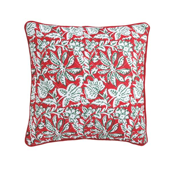 Red and white block print quilted pillow with green accents and a red piped edge.
