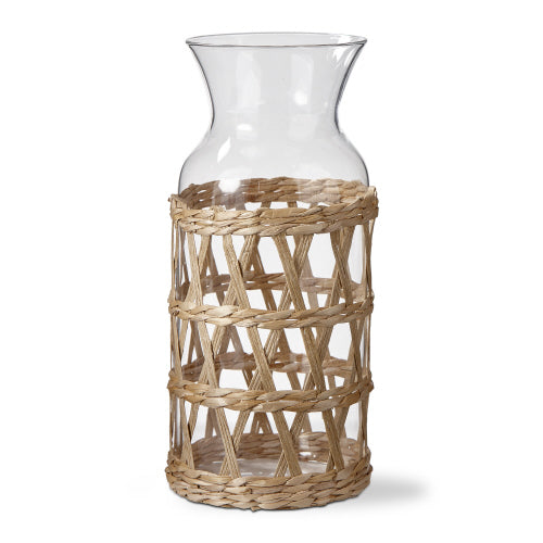 Natural Island Carafe with borosilicate glass body and removable cattail straw sleeve.