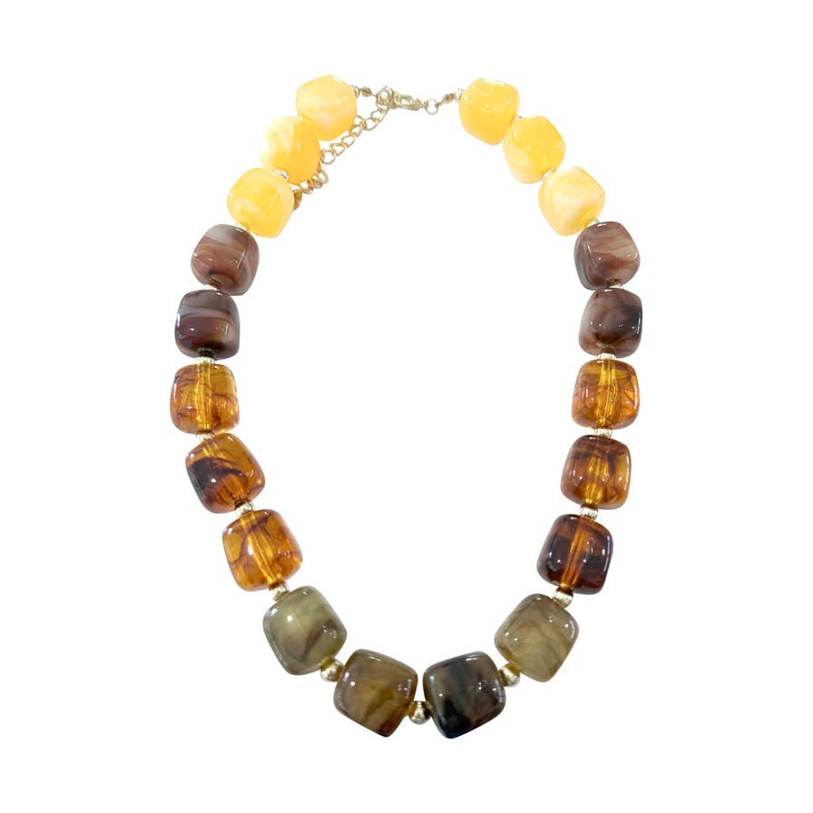 Charlotte Chunky Beaded Necklace with oversized yellow, brown, and marbled earth-tone beads.