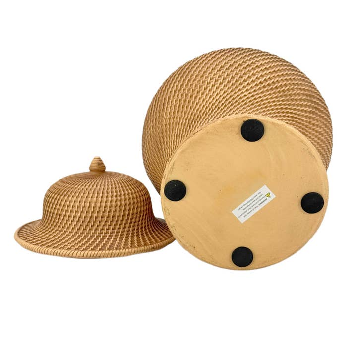 Bottom view of a faux wicker polyresin ginger jar with its domed lid resting beside it.