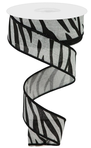 A spool of leopard print ribbon made from polyester.
