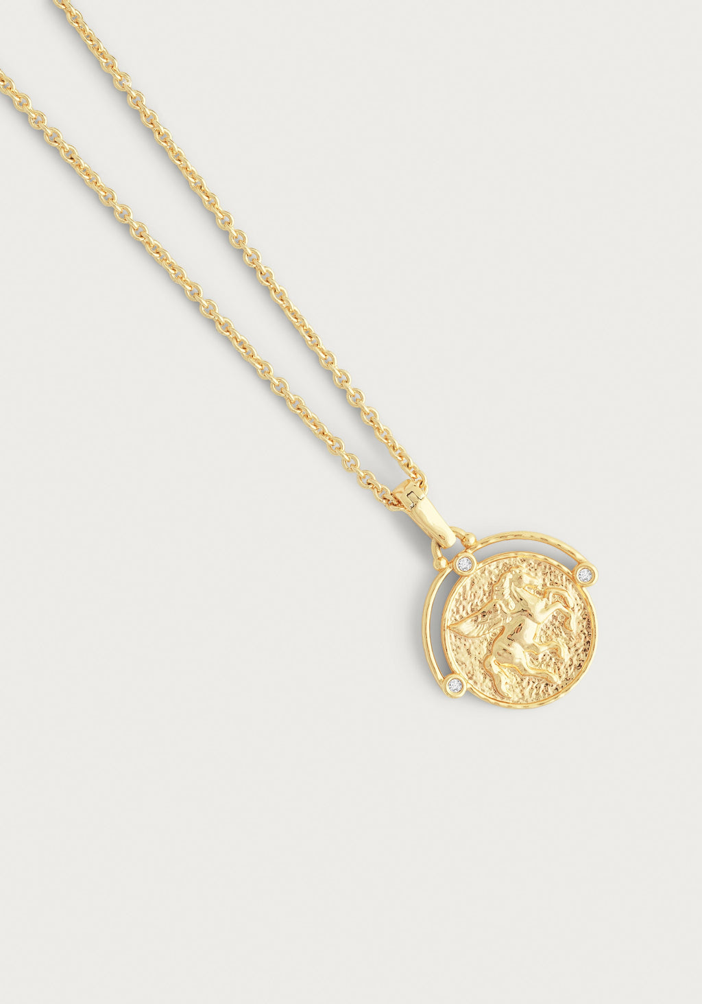 Pegasus Gold Coin Pendant Necklace with an 18K gold plated winged horse coin and crystal accents.