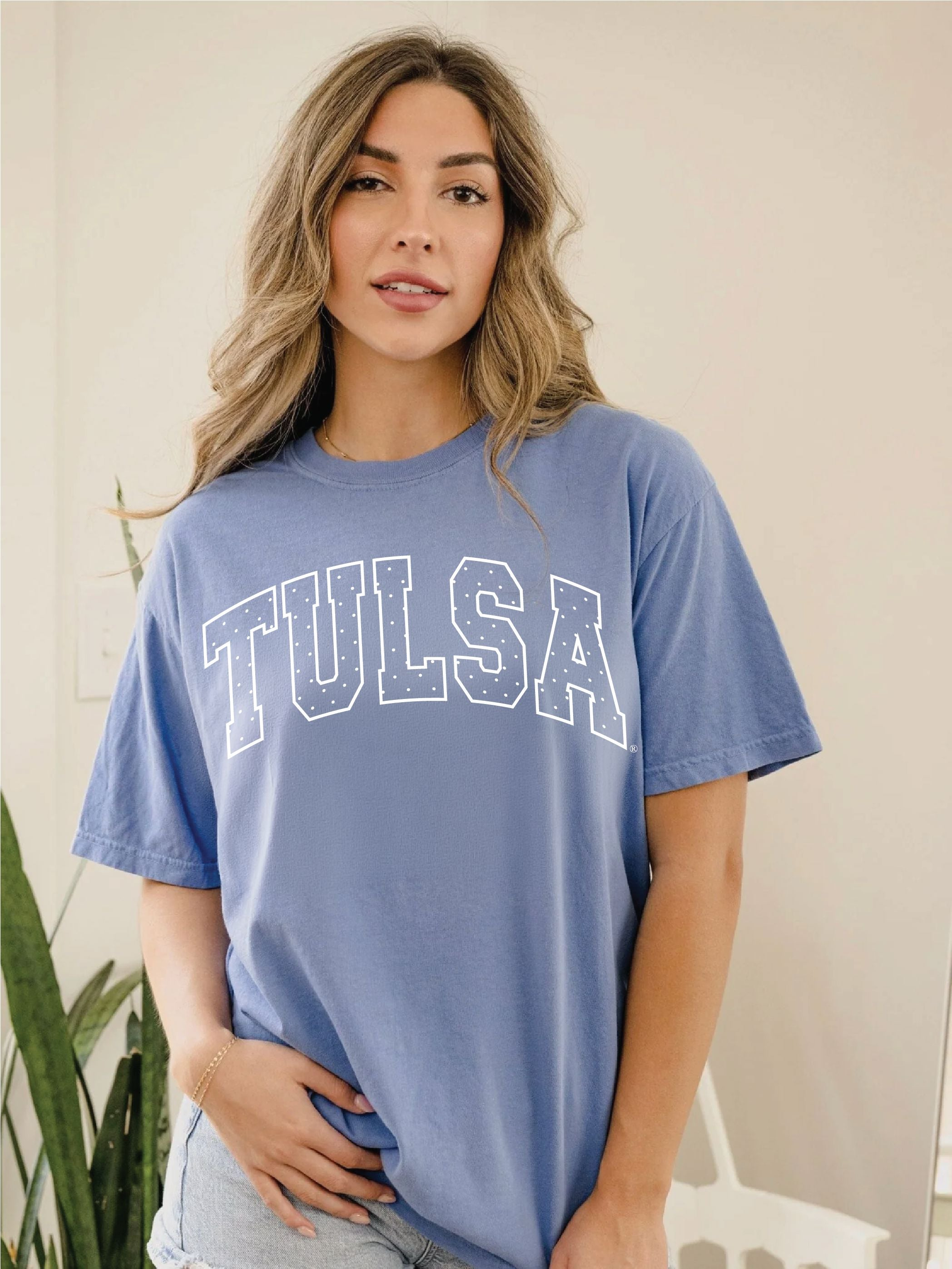 Woman wearing a blue TU Tulsa Hurricane Polka Dot Puff Comfort Colors t-shirt.