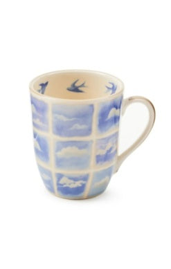 Cloud Watching Mug with blue and white cloud grid pattern and bird illustrations inside the rim.