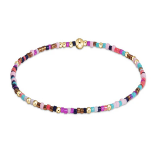 Egirl Hope Unwritten bracelet featuring gold-filled beads with multicolor seed bead accents on stretch elastic.