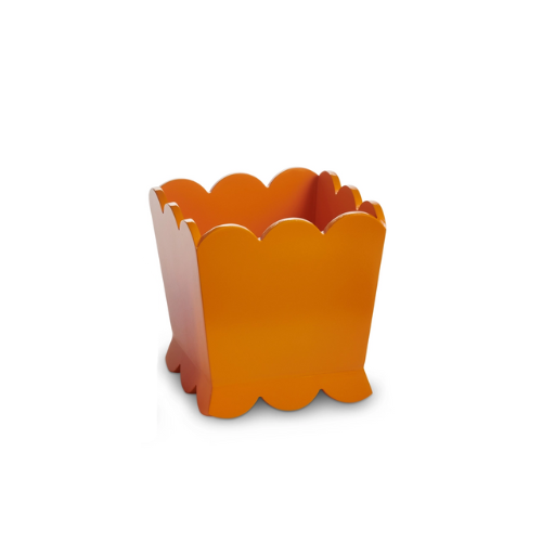 Orange scalloped edge planter made of MDF, shown from a front-angled view.