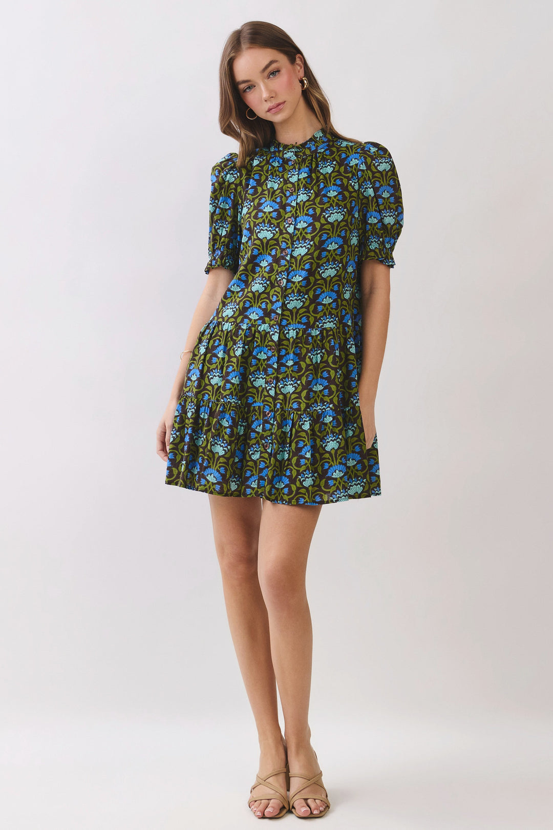 Penelope floral print mini dress with puff sleeves and button front on a model.